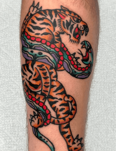 Tattoo of a snake wrapped around a tiger.