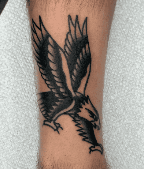 A tattoo of a flying eagle.