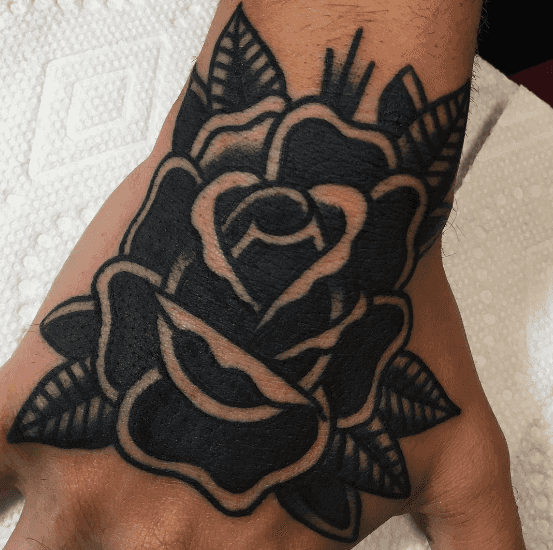 A tattoo of a black rose.