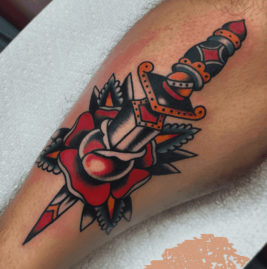 A tattoo of a rose with a dagger through it.